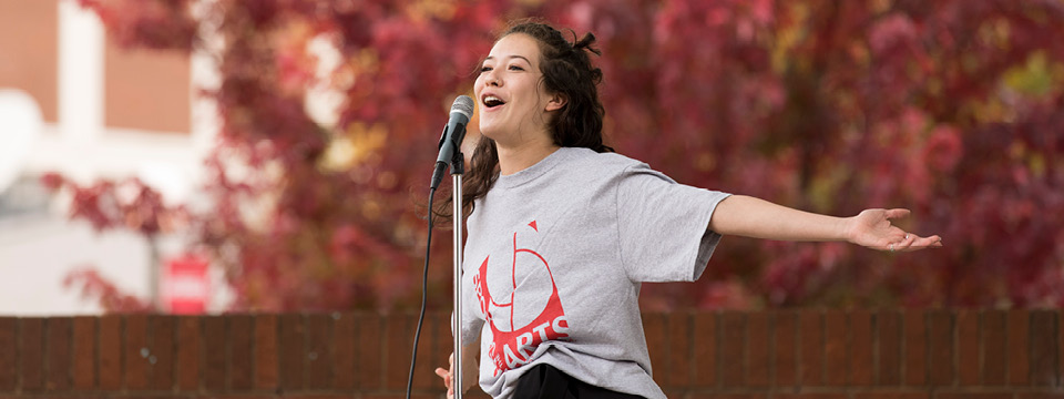 Student singing at arts festival