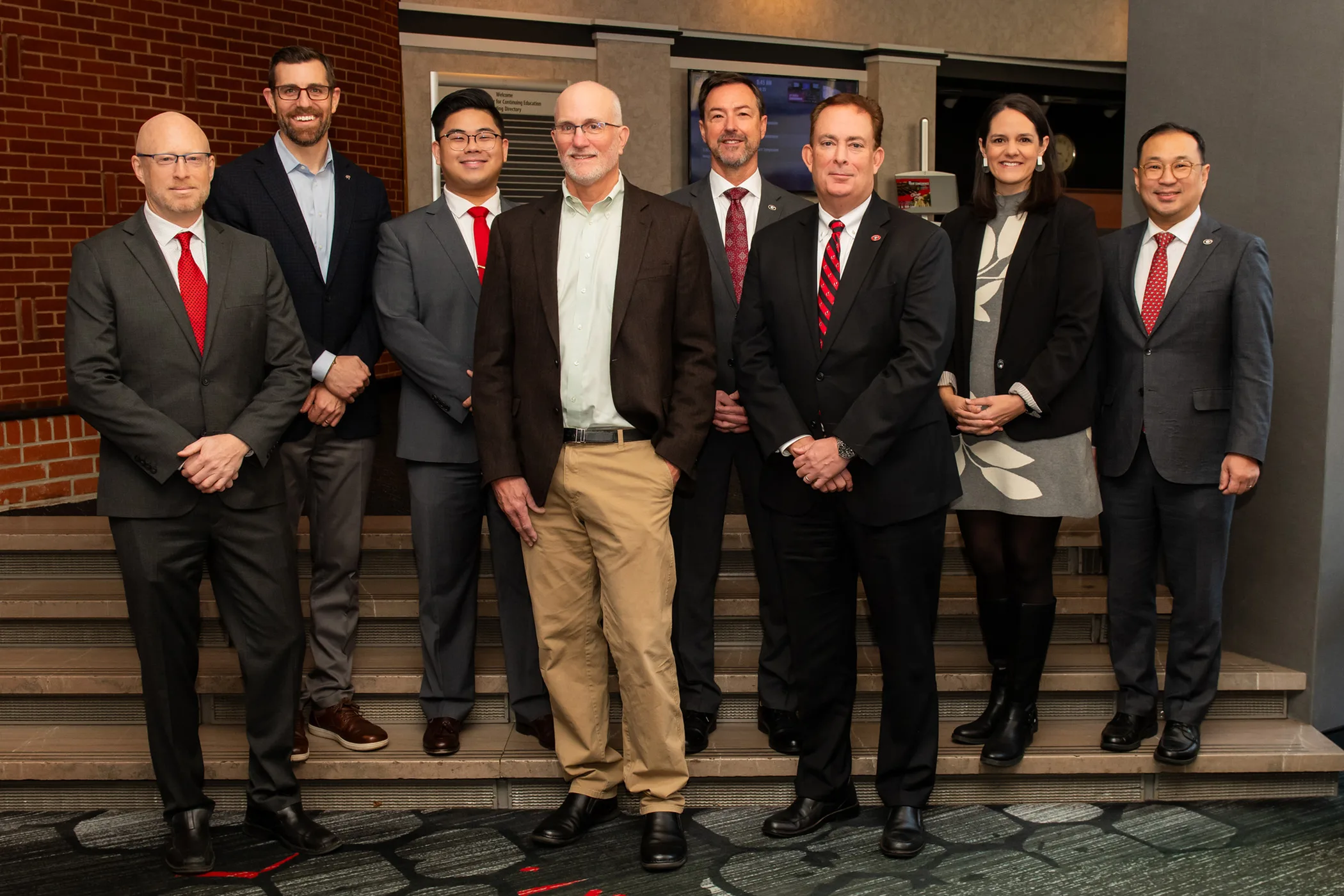 UGA administrators and industry partners, from left to right, Nate Nibbelink, professor of spatial ecology and geographic information science and associate vice president for research; Kyle Tschepikow, senior executive director of development and alumni relations; Nic Laconico, director of industry and foundation initiatives; Todd Cleland, senior fellow, University-Industry Demonstration Partnership; Chris King, interim vice president for research; Benjamin Ayers, senior vice president for academic affairs and provost; Jill Walton, vice president for development and alumni relations; and Philip Hong, dean and professor, School of Social Work. (Photo by Justin Evans Photography)
