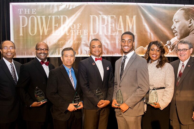 From left, the Honorable Steve C. Jones and 2020 Fulfilling the Dream award recipients Marvin J. Nunnally, Cesar L. Escalante, Marques R. Dexter, Caleb Kelly, Sherontae Maxwell and President Jere W. Morehead pose for a picture at the 2020 Martin Luther King Jr. Freedom Breakfast on Jan. 17, 2020. (Photo by Dorothy Kozlowski/UGA)