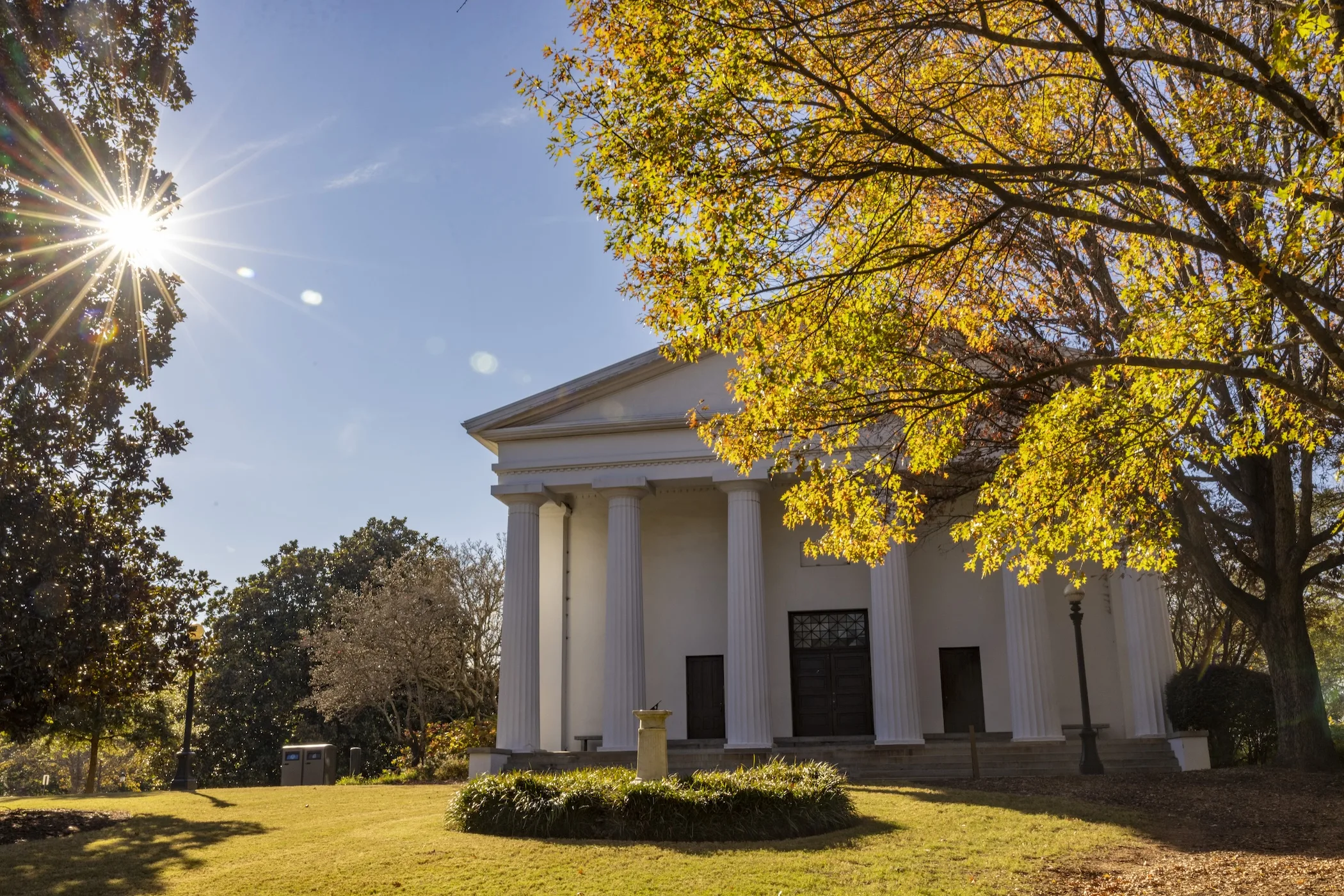 UGA Chapel behind a tree with golden leaves (Photo by Dorothy Kozlowski/UGA)