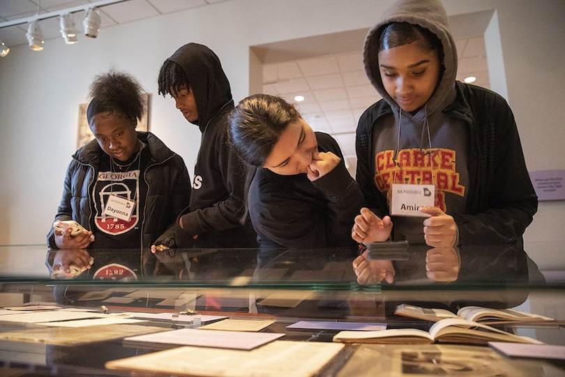 From left, Clarke Central High School students Dayonna Robinson, Khalil Walker, Gabriela Rodriguez, and Amira Adkins look at part of the exhibit “The Strategies of Suffrage: Mobilizing a Nation for Women’s Rights,” an exhibit at the in the Hargrett Library Gallery. (Photo by Peter Frey/UGA)