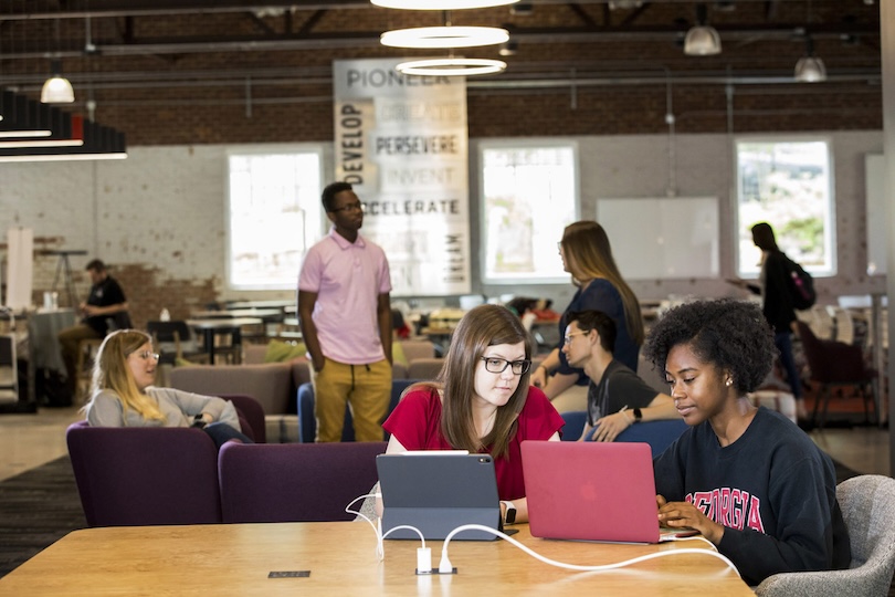 (Front L-R) Undergraduate students Cammi Chaves and Amari Allen study inside of Studio 225.