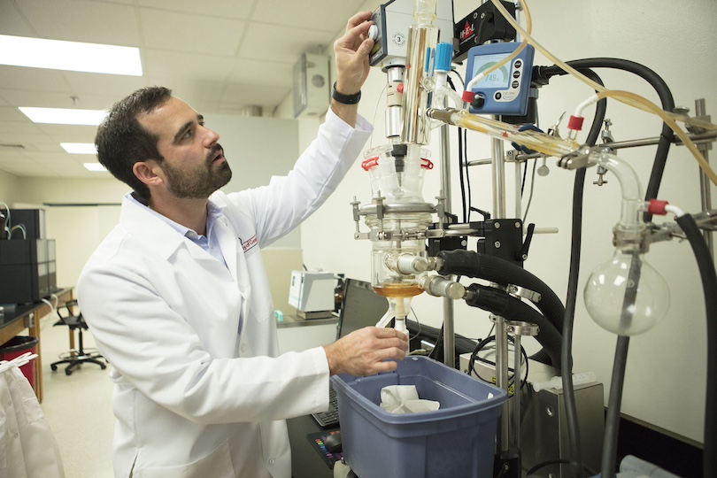 Jason Locklin adjusts an instrument in one of his laboratories. Locklin, who directs the UGA New Materials Institute, is a Distinguished Faculty Scholar in the College of Engineering and a professor. (Photo by Terry Allen taken in 2017)