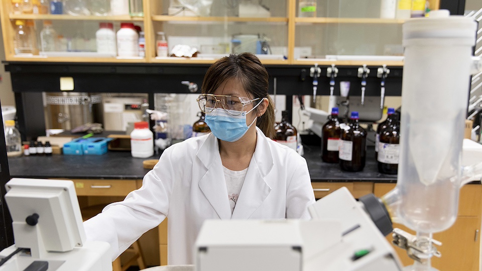 Research scientist Mia Ji works with a rotary evaporator as she runs an experiment in Rob Woods’ lab at the CCRC. Wood’s work is directly related to COVID-19 and his lab has continued to work during the outbreak.