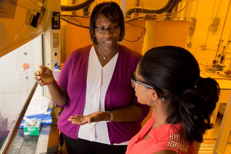 Cheryl Gomillion in her lab talking to a student. (Photo by Andrew Davis Tucker/UGA taken in 2016)