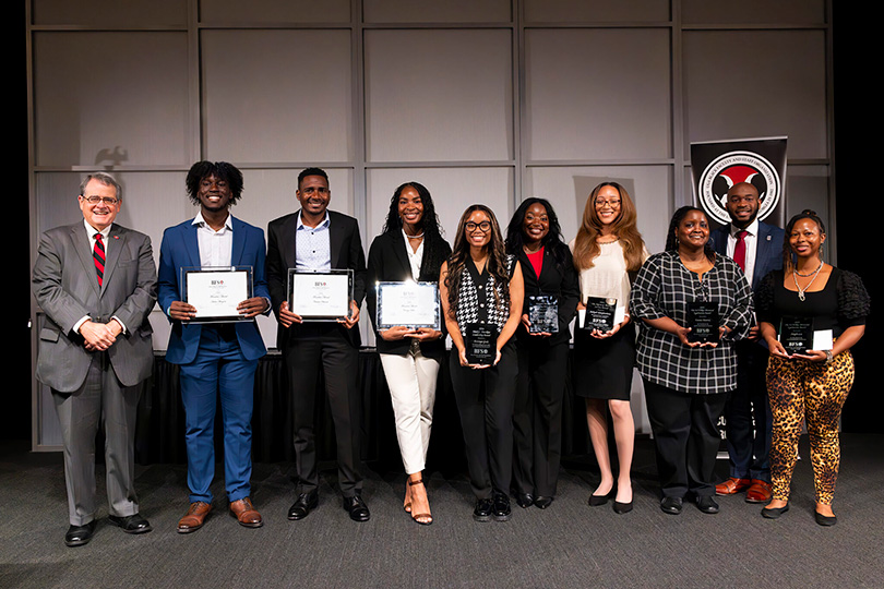 Shown, from left, are UGA President Jere W. Morehead with award and scholarship recipients Andre Akinyemi, Christian Okitondo, Camryn Hollis, Arionya Gude, Rayna Carter, Aaliyah Khaiphanliane, Emma Mattox, Xavier Brown and Shayla Lee. (Photo by Dorothy Kozlowski/UGA)