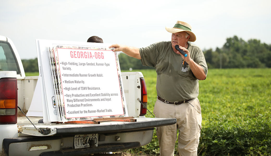 UGA professor and peanut breeder William “Bill” D. Branch teaching in a field.