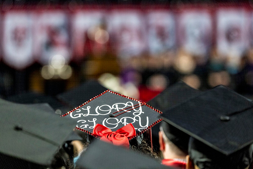 A decoration graduation cap with "Glory Glory" at a UGA Commencement ceremony