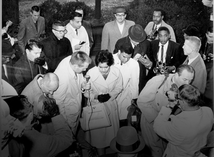 Charlayne Hunter and Hamilton Holmes are greeted by the press as they walk toward the Admissions Office in the Academic Building on Jan. 9, 1961, to enroll as the first African American students at UGA.