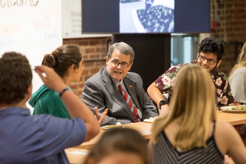 President Jere W. Morehead talks with a group of students. (UGA photo)