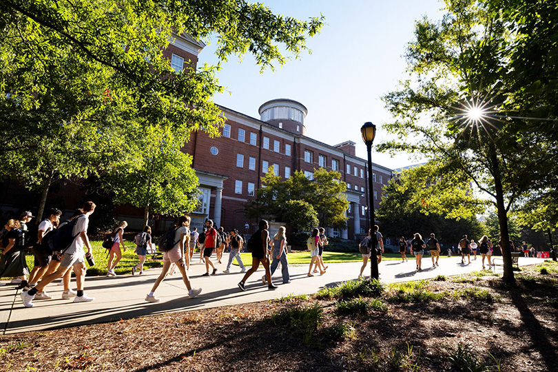 Students walk on the Georgia Quadrangle next to the Miller Learning Center. (Andrew Davis Tucker/UGA)