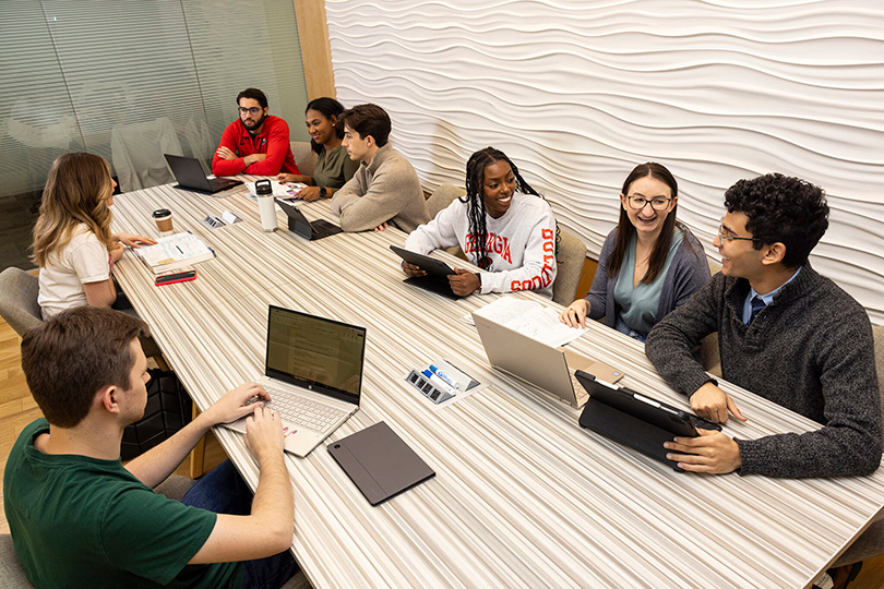 UGA students sitting together around a table